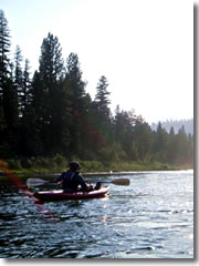 Dan Berger takes a moment to relax and paddle a duckie down the river.