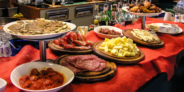 Free stuzicchini-Italian snacks-laid out on a bar at the apertivo hour