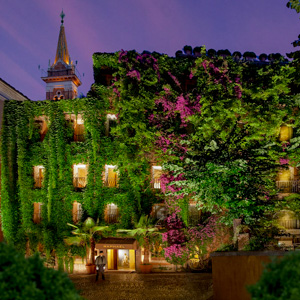 The ive-clad facade of the Hotel Raphael in Rome, Italy