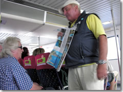 A tout sells tours to prospective clients on a baot from Sorrento to Capri